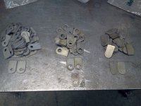 2014-10-05 15.59.47  100 Brake Line mount tabs at less than $1 a piece much cheaper than buying them 1 by 1 somewere else.  Some with 3/8" hole, some with 5/8" hole and some with a Scribe centerpuch mark for drilling to required size.